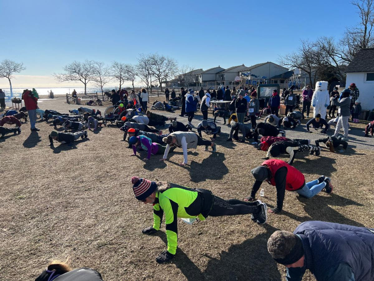 Participants did 22 push-ups at the start of the event to warm up.